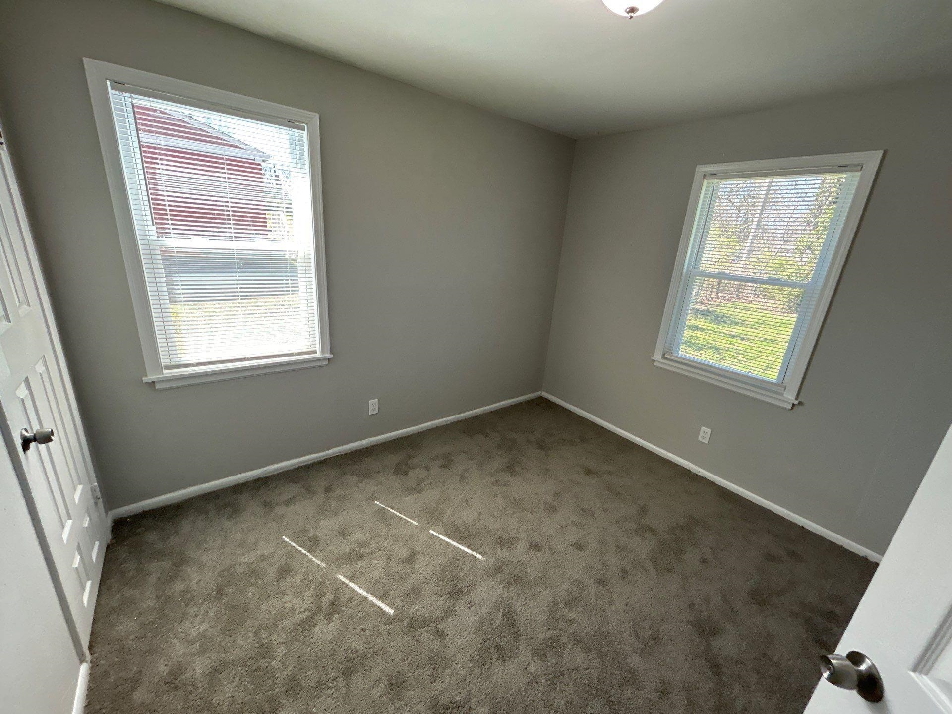 4989 Neely Road Memphis, TN 38109 - Photo 3 of 8 a view of an empty room with a window