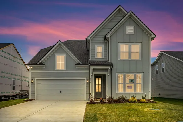 a front view of a house with a yard