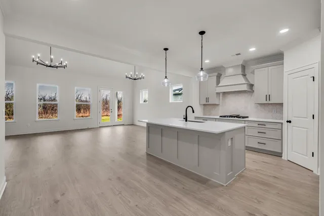 a view of room with furniture and wooden floor