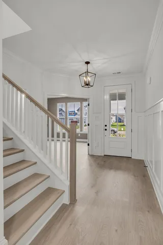 a bathroom with a toilet a sink and a mirror