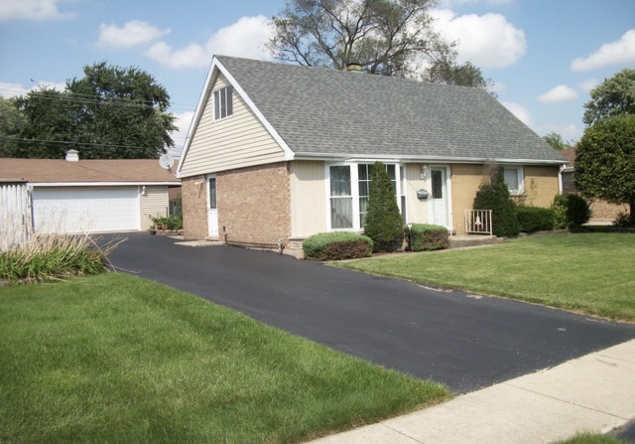 6932 West 91st Street Bridgeview, IL 60455 - Photo 2 of 3 a view of a house with a yard