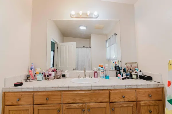 a bathroom with a sink and a mirror