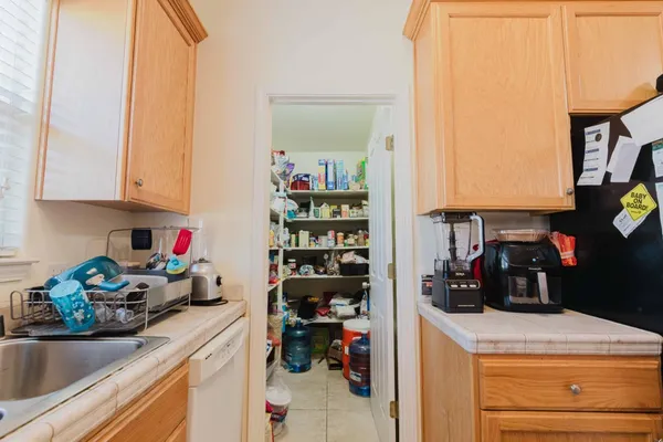 a kitchen with a sink and cabinets