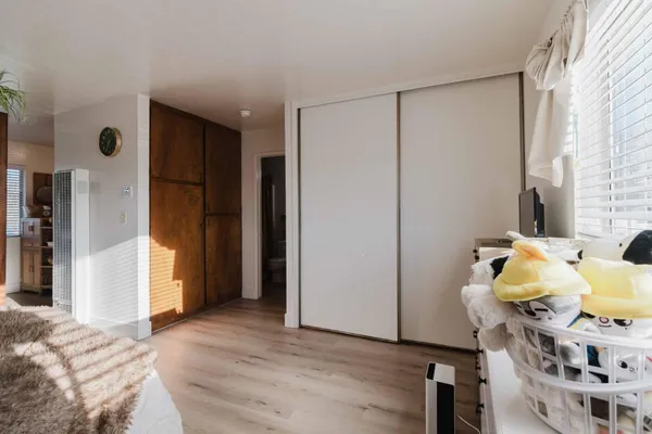 a view of living room with furniture and wooden floor