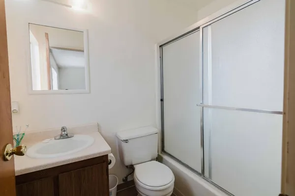 a bathroom with a sink toilet and vanity