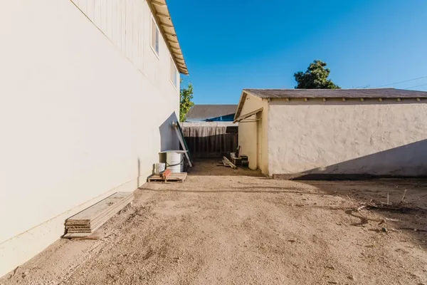 a view of a room with furniture and a window