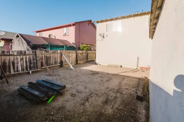an aerial view of a house with a swimming pool