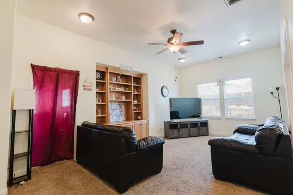 a living room with furniture workspace and a window