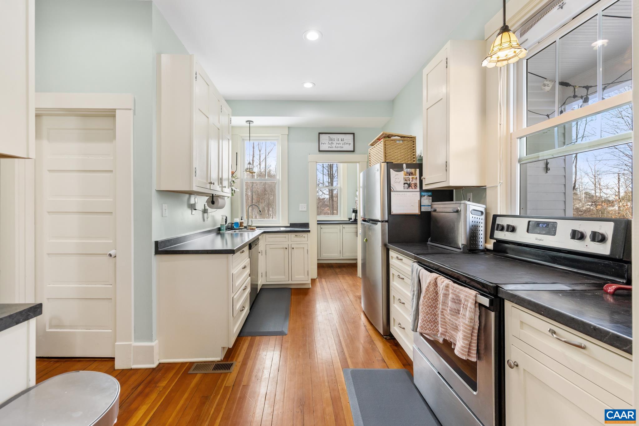 4615 Davis Highway Louisa, VA 23093 - Photo 12 of 29 a large kitchen with stainless steel appliances granite countertop a lot of counter space and a wooden floors