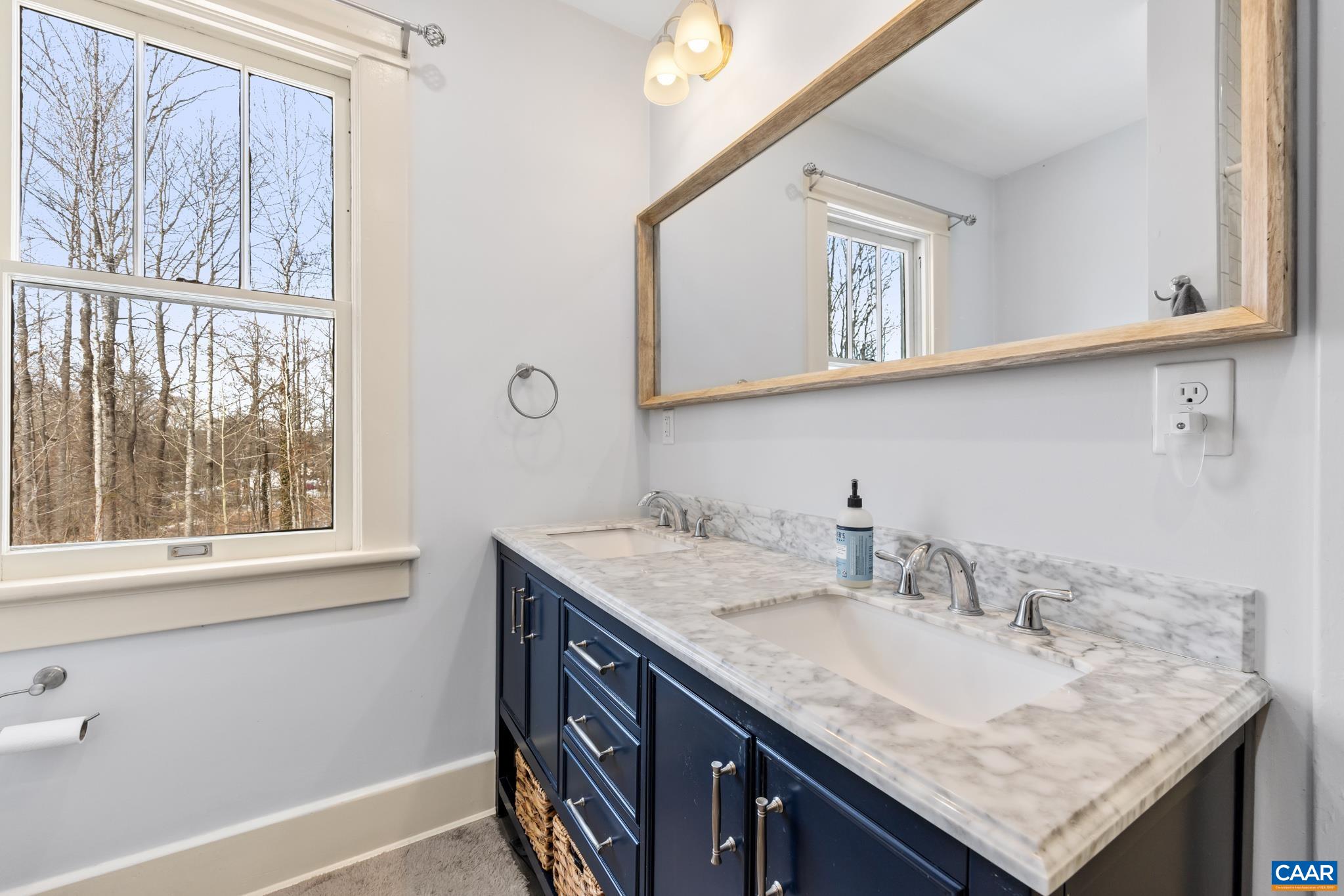 4615 Davis Highway Louisa, VA 23093 - Photo 19 of 29 a bathroom with a granite countertop sink and a window