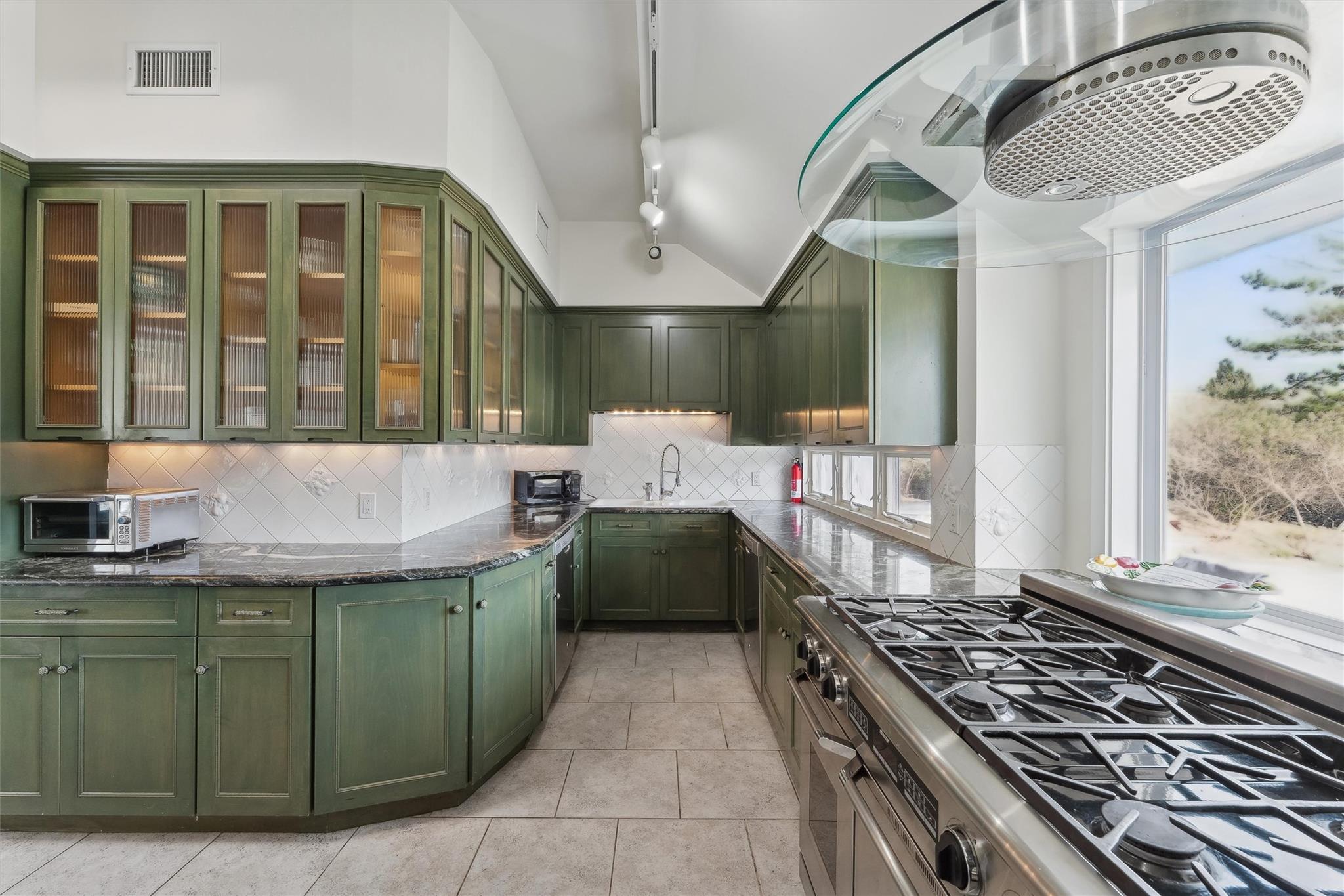 11 Watersedge Court Westhampton Beach, NY 11978 - Photo 15 of 24 a kitchen with a table and chairs