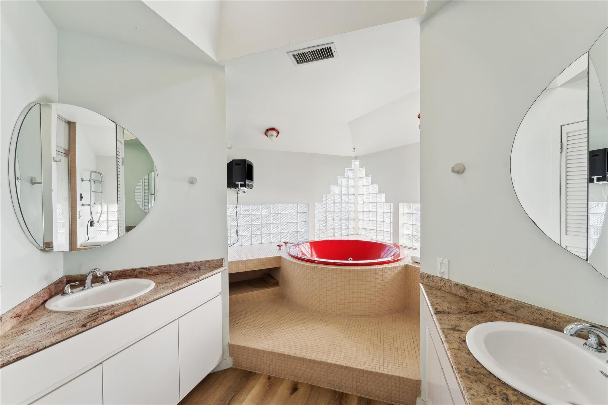 11 Watersedge Court Westhampton Beach, NY 11978 - Photo 21 of 24 a bathroom with a granite countertop sink and a mirror