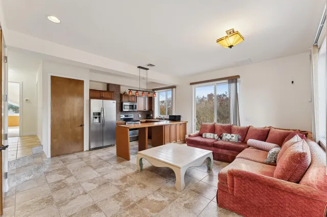 a living room with furniture and a table