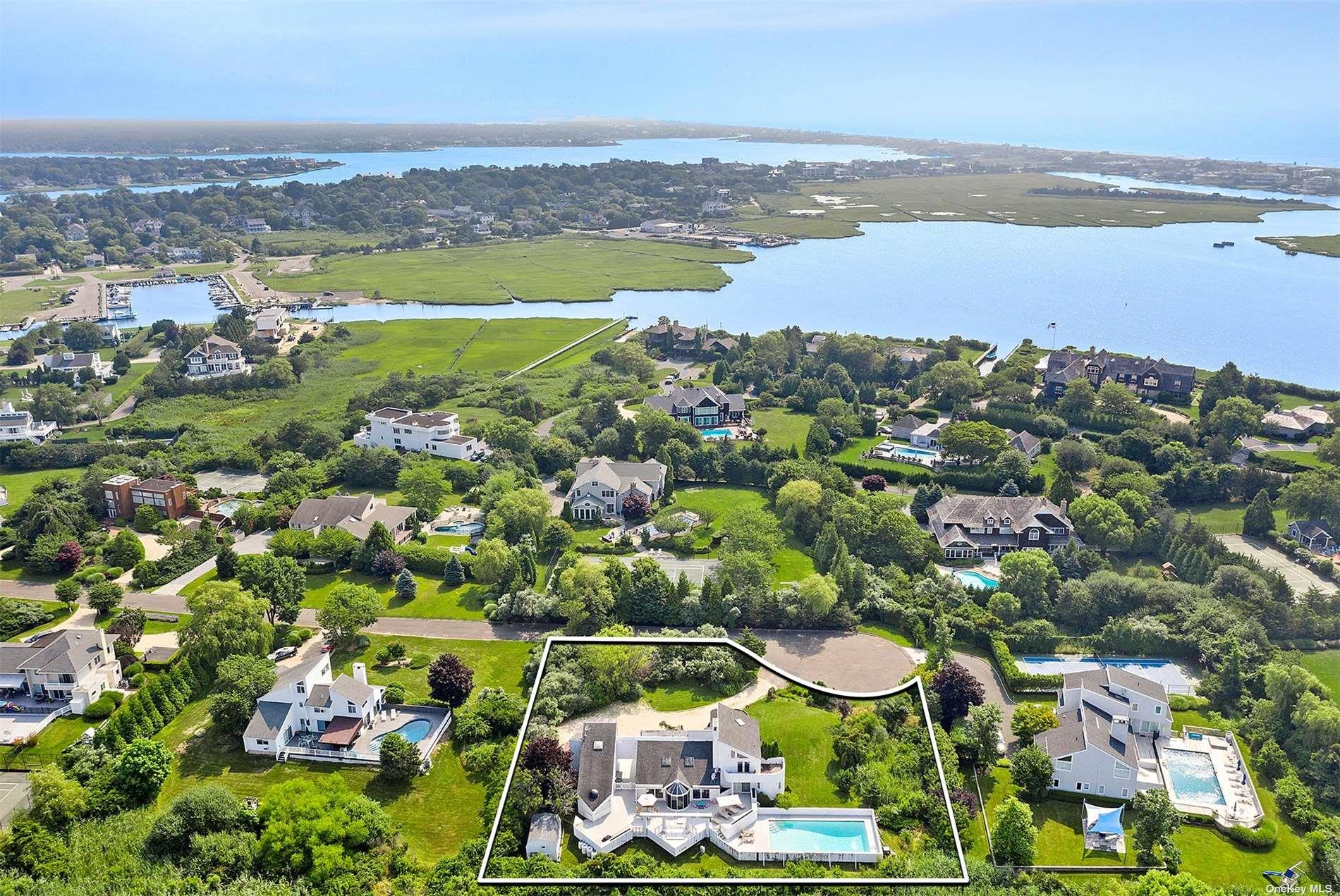11 Watersedge Court Westhampton Beach, NY 11978 - Photo 7 of 24 an aerial view of residential houses with outdoor space and swimming pool