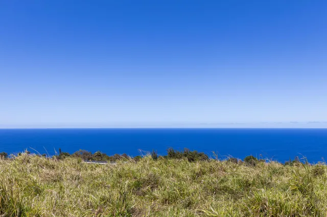 a view of balcony with a yard