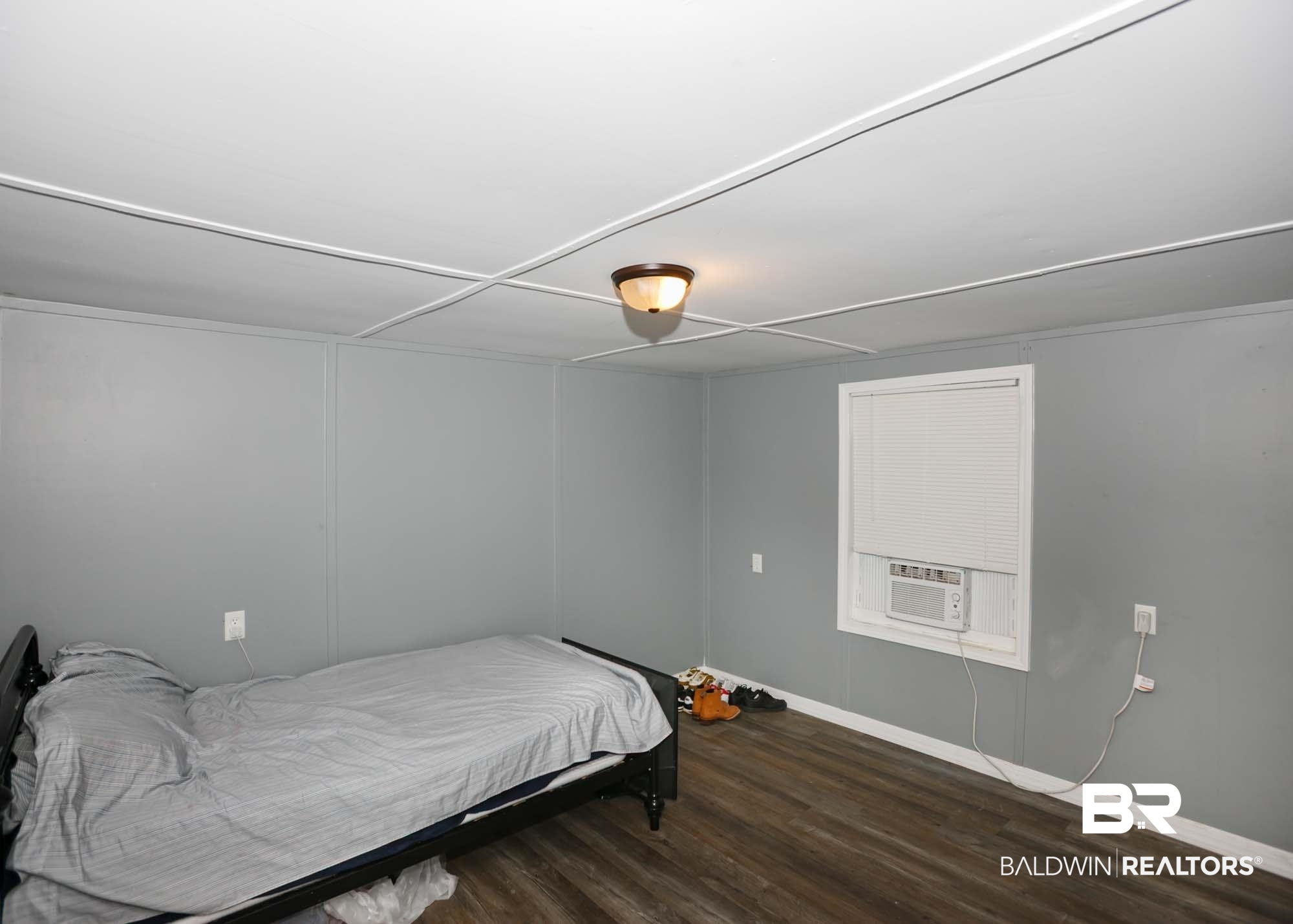 11998 Workman Avenue Foley, AL 36535 - Photo 21 of 59 Bedroom featuring wood finished floors and baseboards