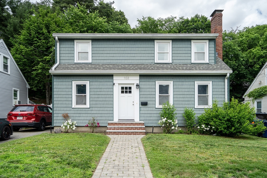 103 Stimson Street Boston, MA 02132 - Photo 1 of 10 a red car parked in front of a house