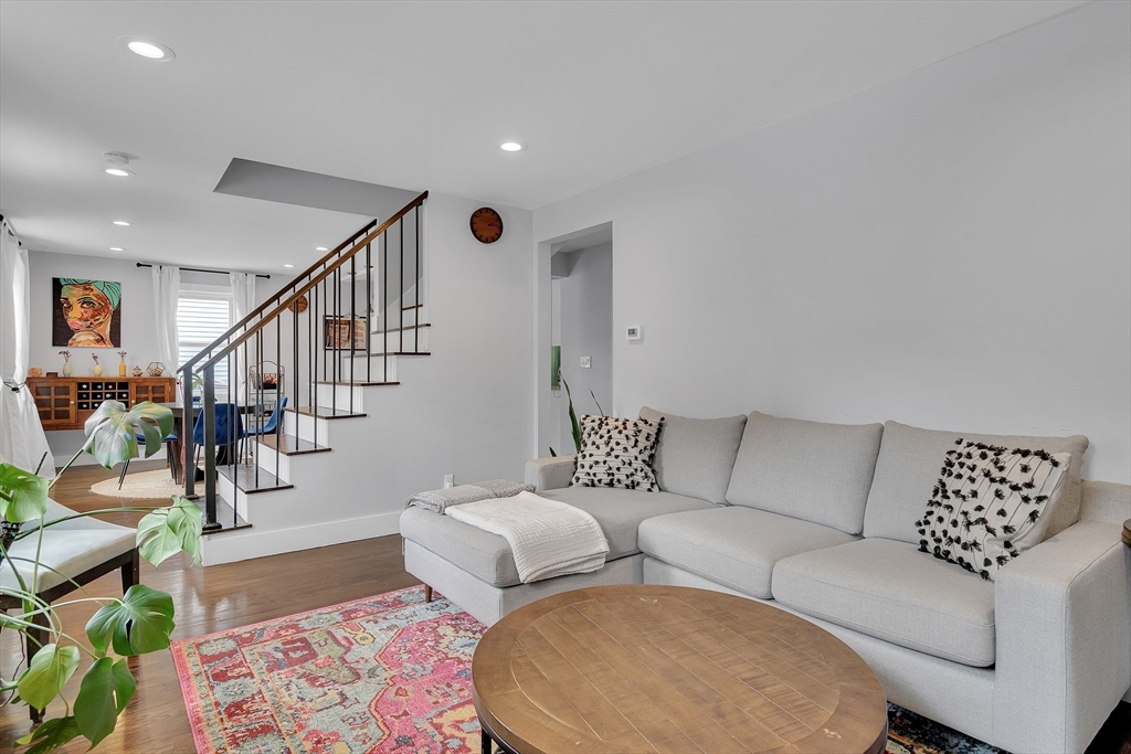 103 Stimson Street Boston, MA 02132 - Photo 3 of 10 a living room with furniture and a rug