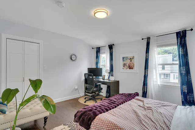 a bedroom that has a bed and a window