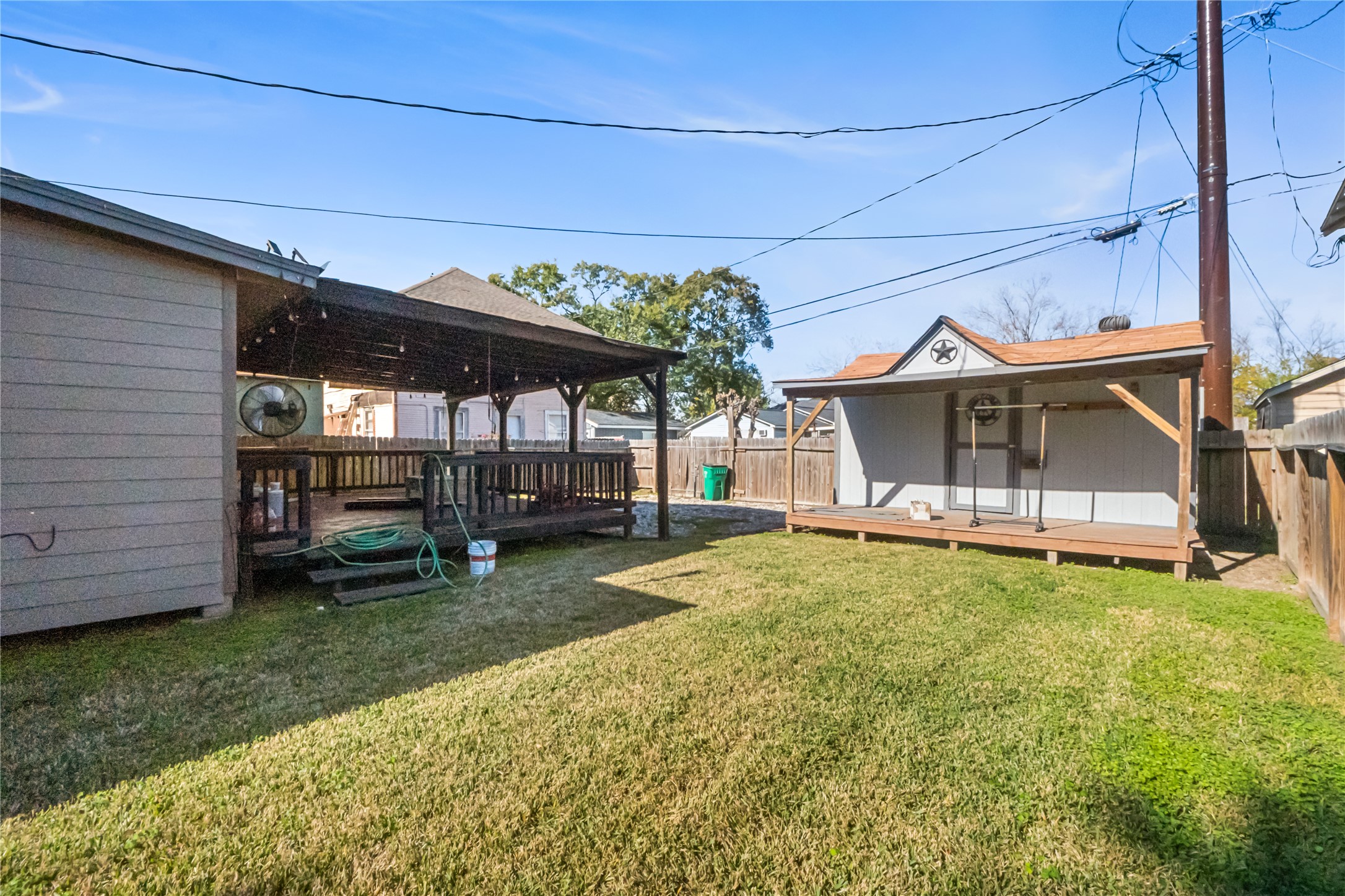 3108 Indiana Street Baytown, TX 77520 - Photo 19 of 20 a view of a house with a backyard and porch