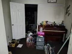 a view of a livingroom with furniture and a window