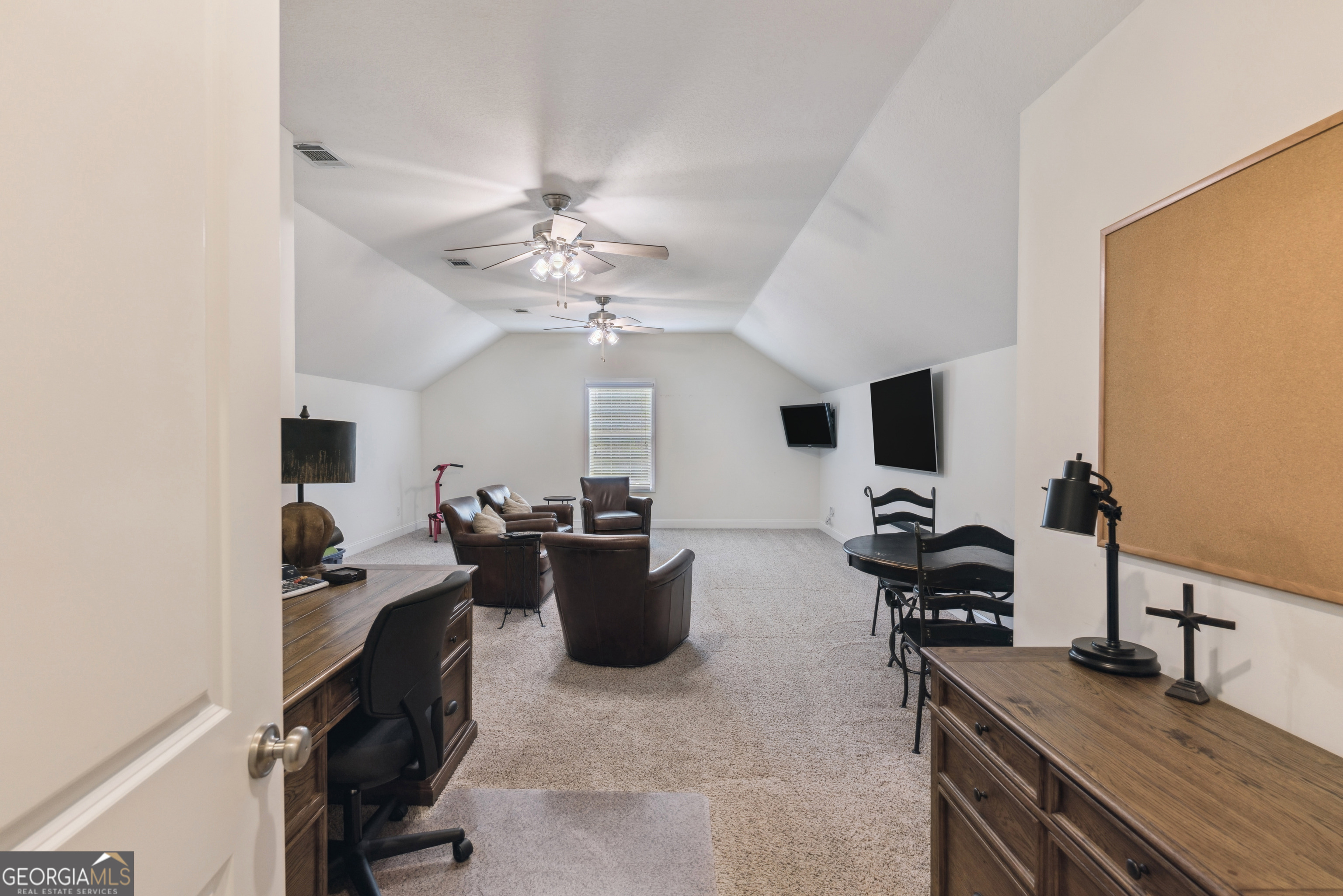 41 Simonton Lane St. Simons Island, GA 31522 - Photo 13 of 28 a view of a livingroom with workspace and a window
