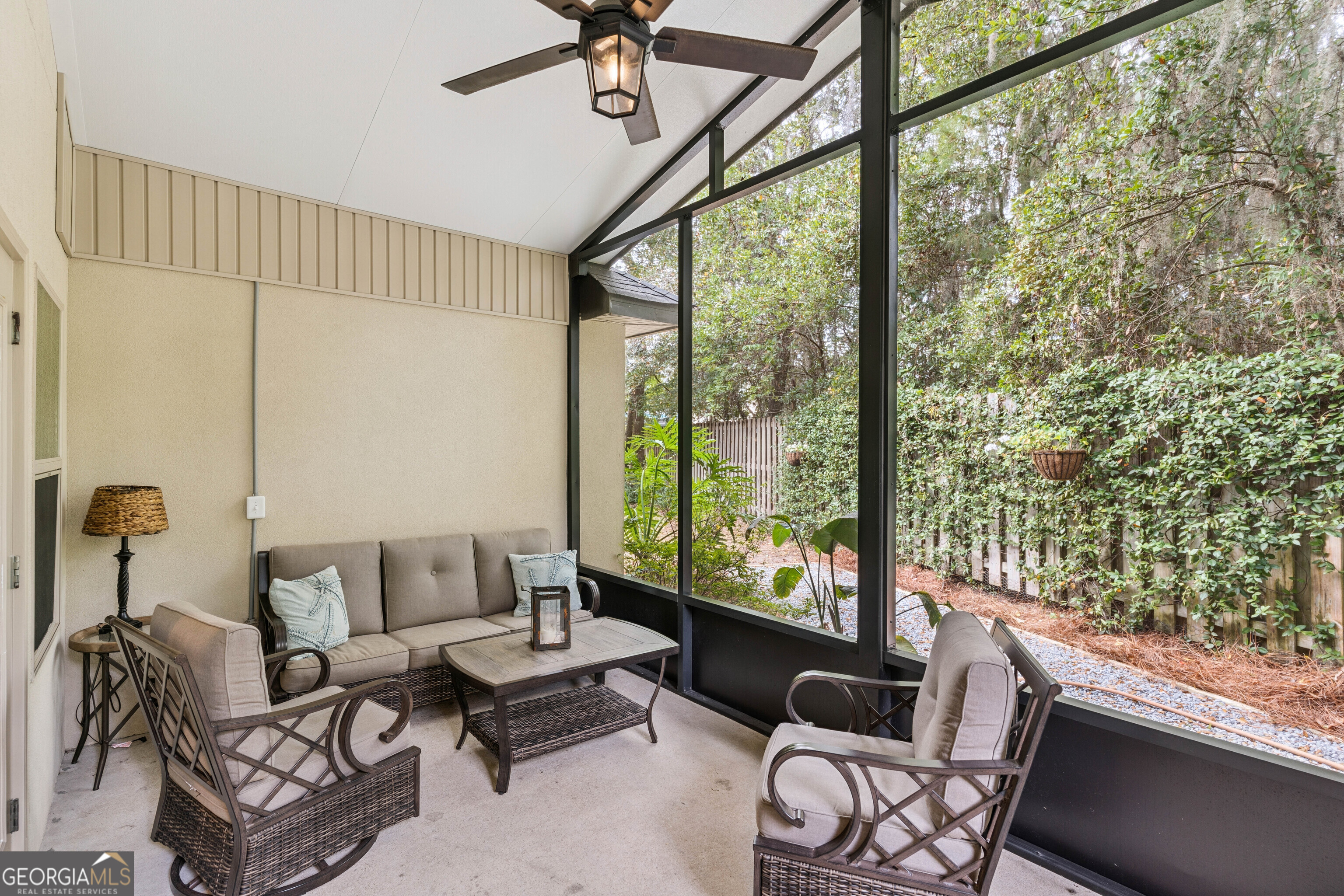 41 Simonton Lane St. Simons Island, GA 31522 - Photo 18 of 28 a living room with furniture and a floor to ceiling window
