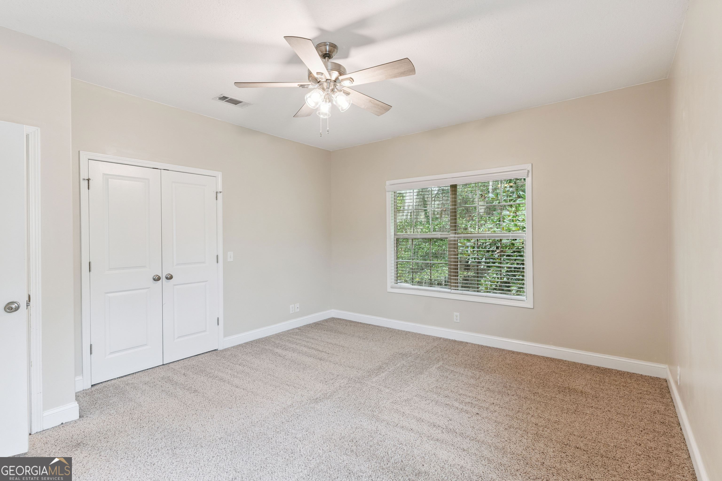 41 Simonton Lane St. Simons Island, GA 31522 - Photo 22 of 28 a view of an empty room with a window