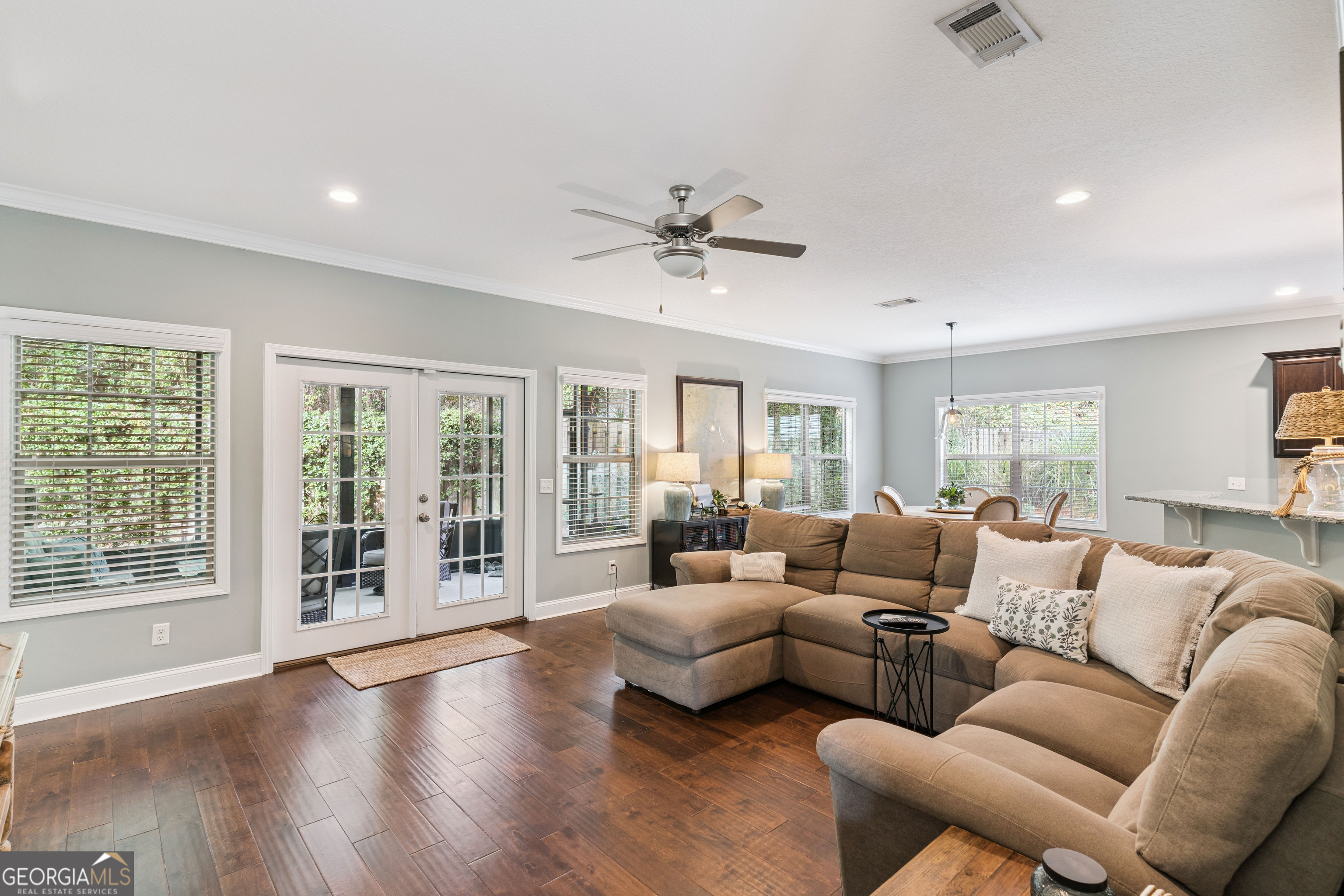41 Simonton Lane St. Simons Island, GA 31522 - Photo 5 of 28 a living room with furniture and windows