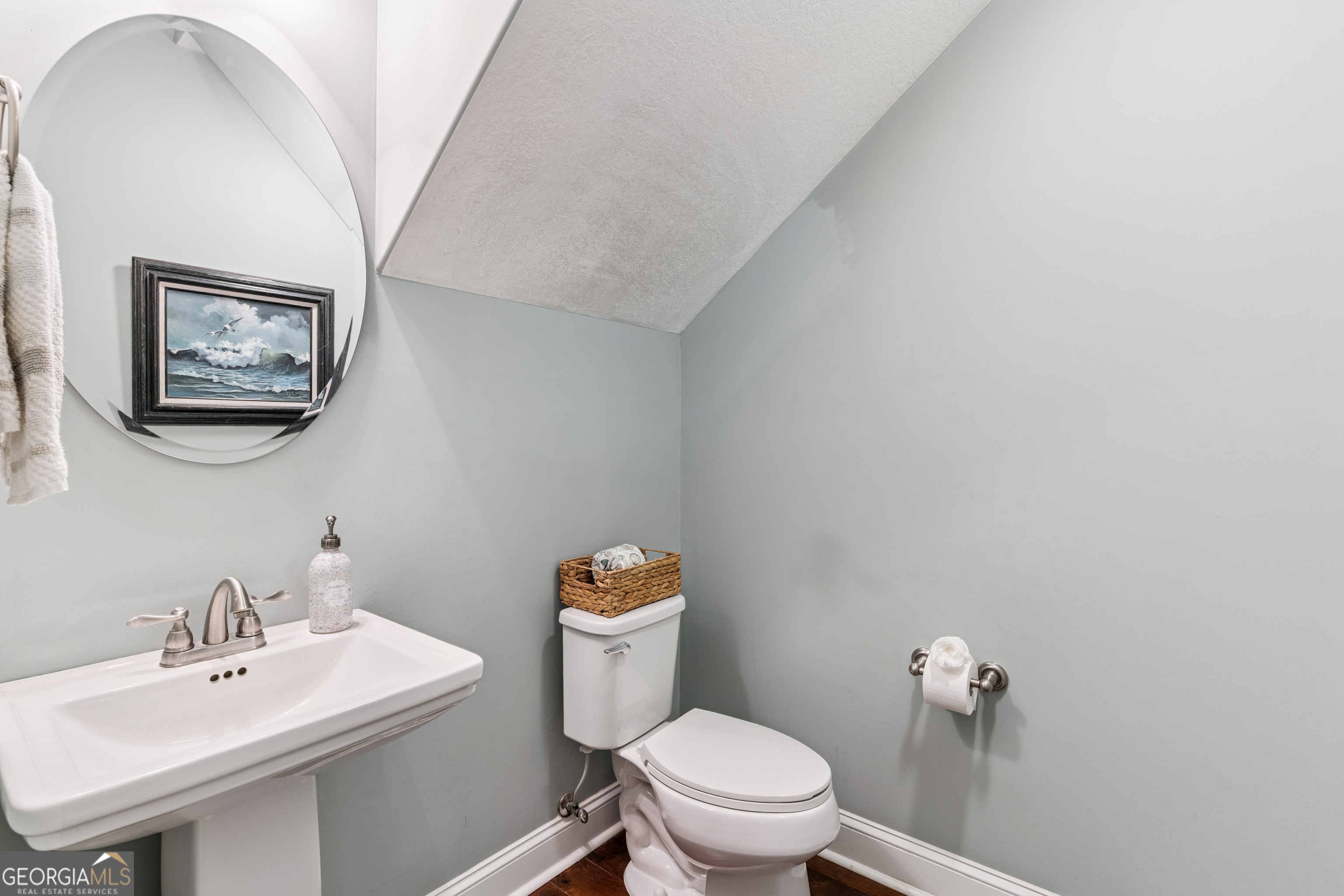 41 Simonton Lane St. Simons Island, GA 31522 - Photo 6 of 28 a bathroom with a toilet a sink and mirror