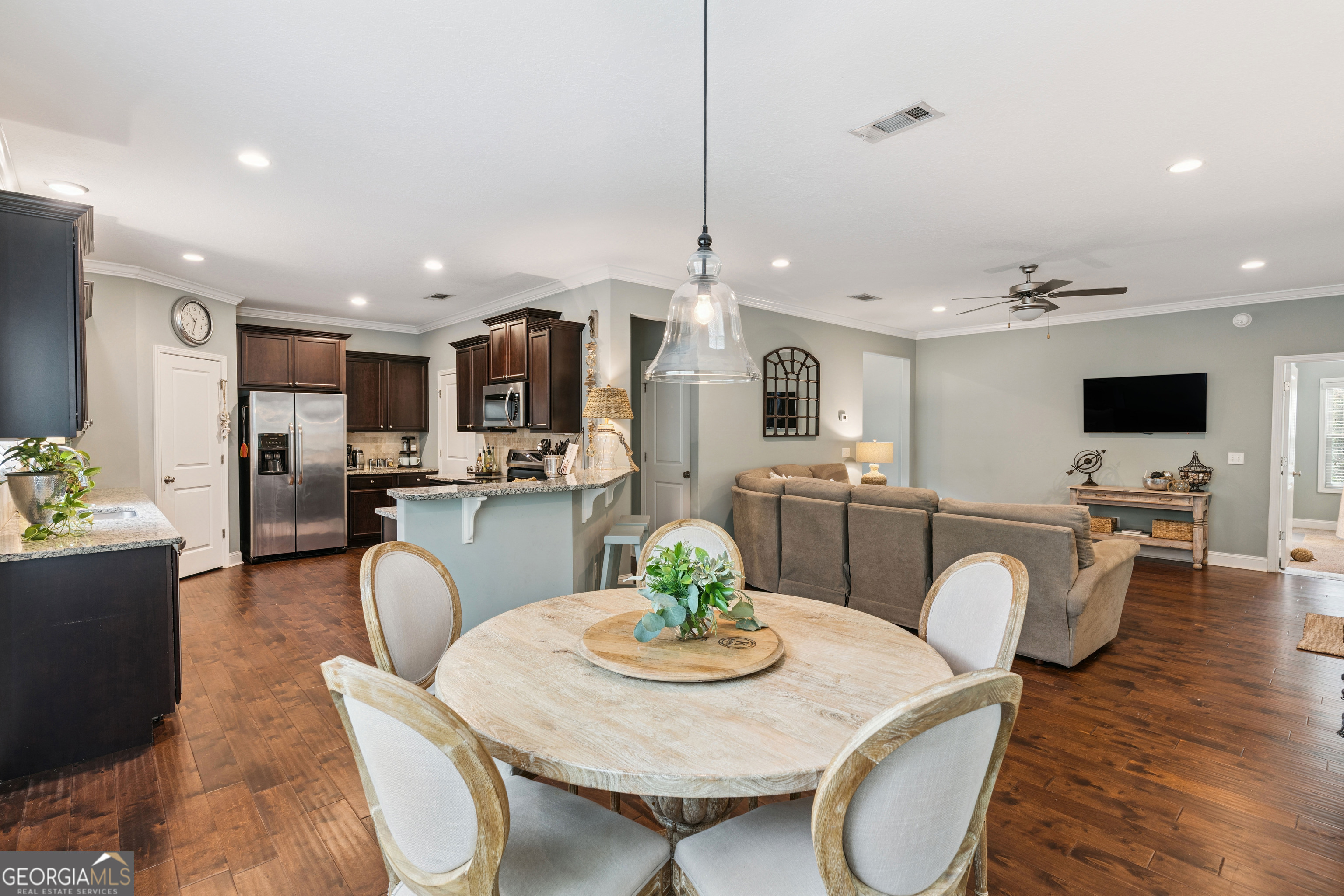 41 Simonton Lane St. Simons Island, GA 31522 - Photo 9 of 28 a view of a dining room with furniture and wooden floor