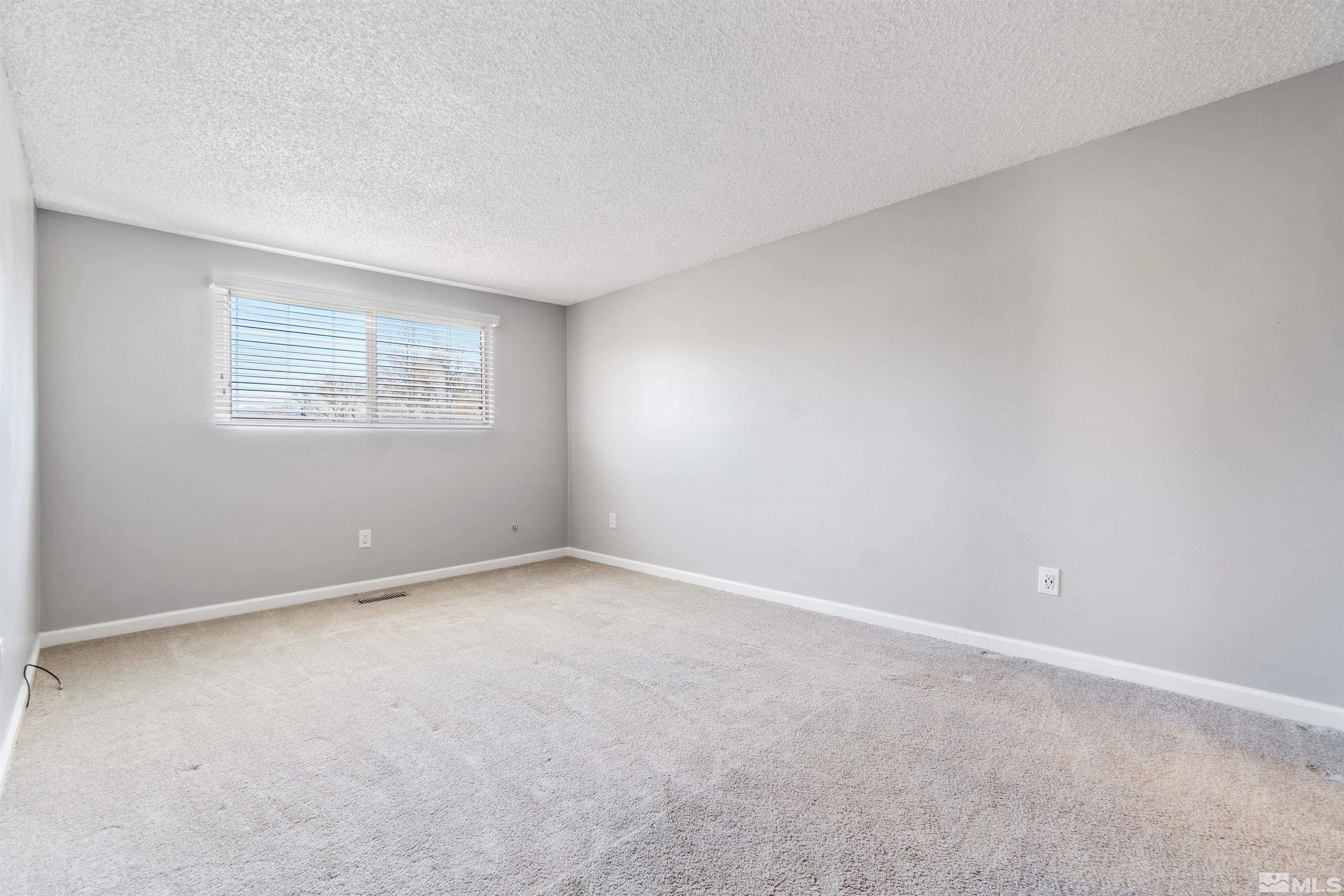 29 Condor Circle Carson City, NV 89701 - Photo 18 of 28 an empty room with a window