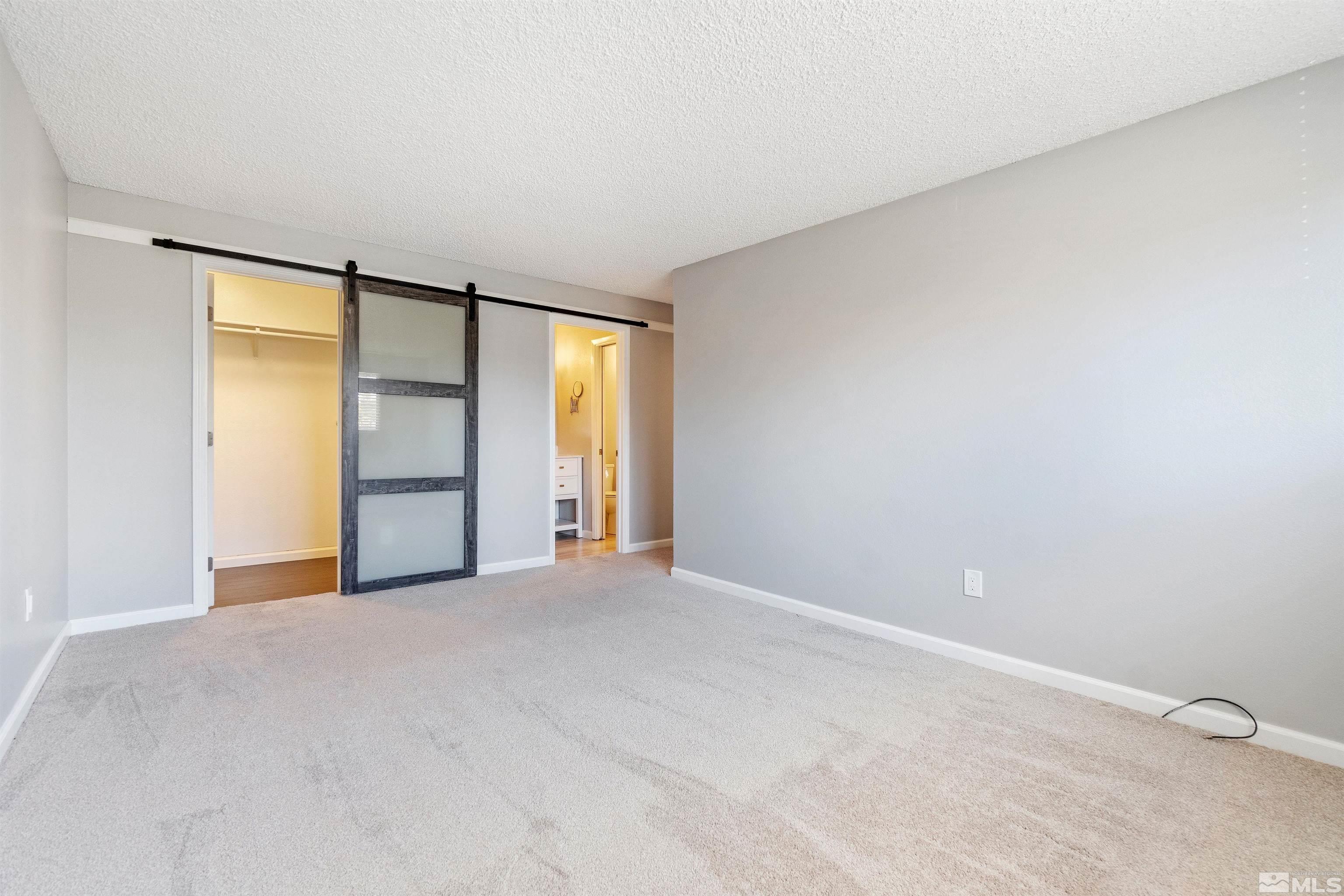 29 Condor Circle Carson City, NV 89701 - Photo 19 of 28 a view of an empty room with a window