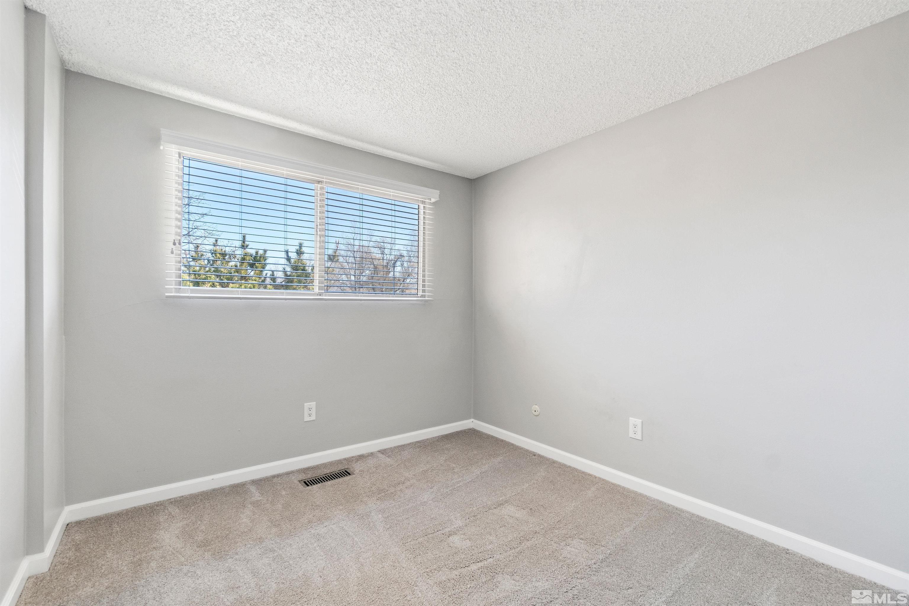 29 Condor Circle Carson City, NV 89701 - Photo 21 of 28 an empty room with a window