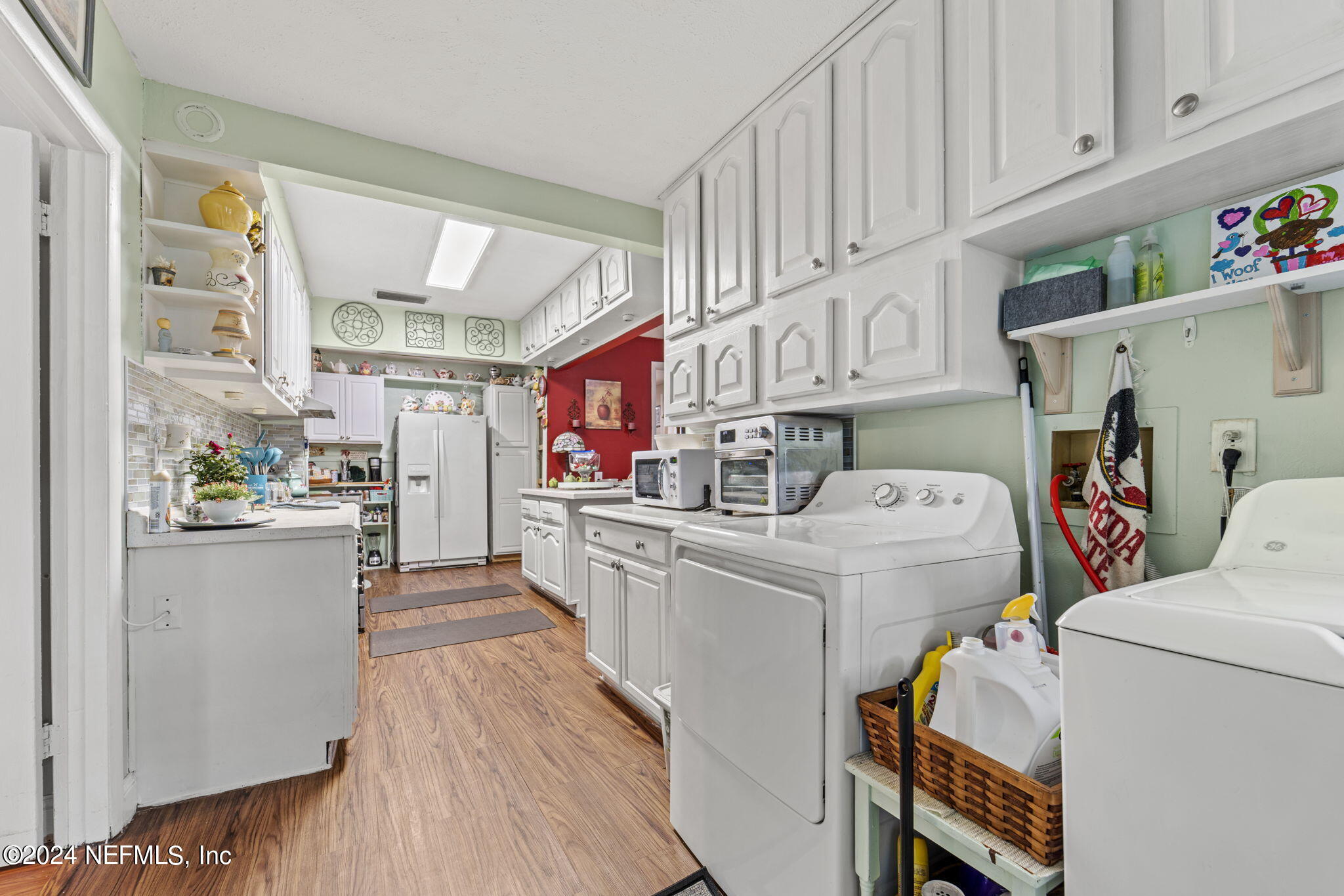 2038 Reed Avenue Jacksonville, FL 32207 - Photo 11 of 43 a storage room with washer and dryer