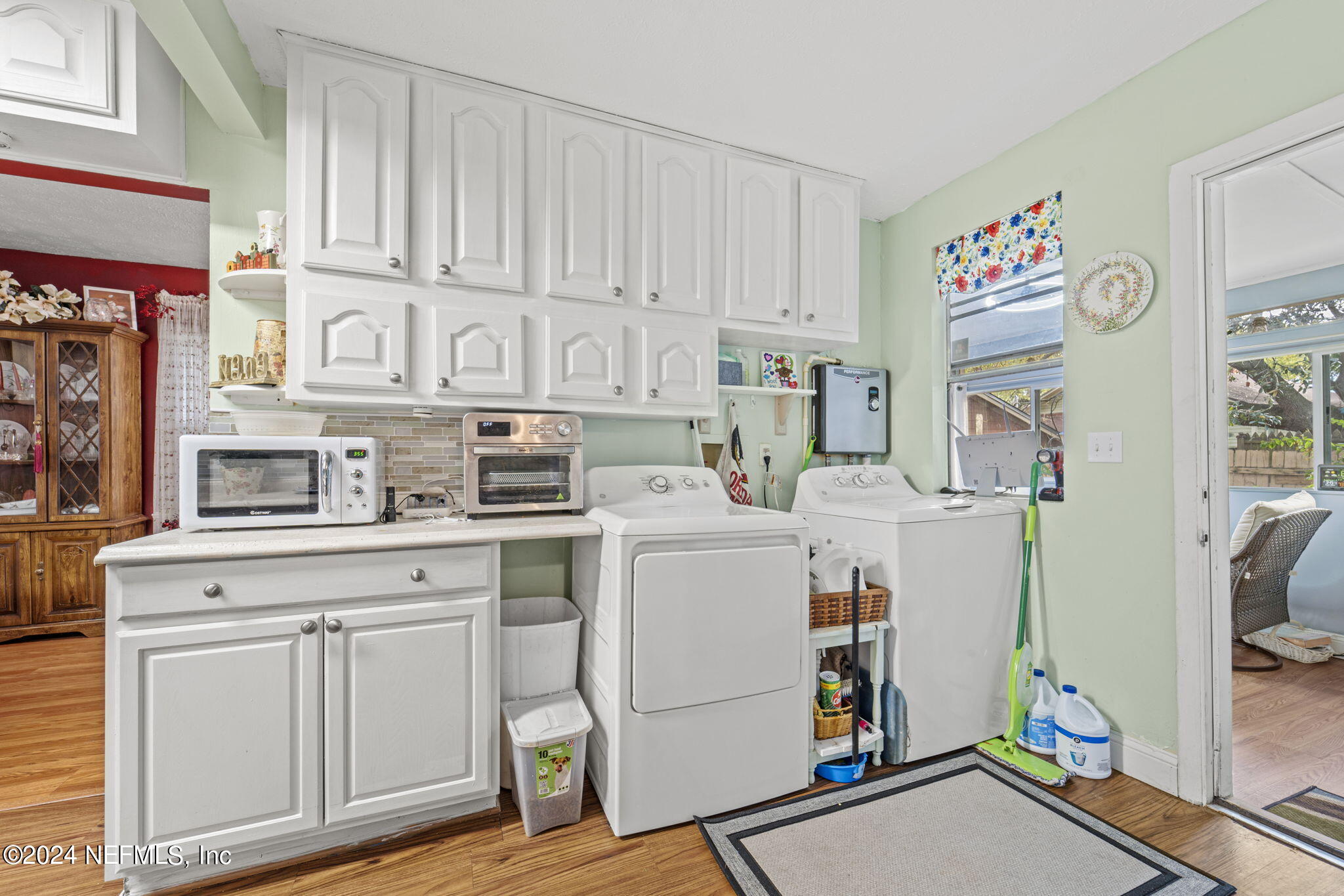 2038 Reed Avenue Jacksonville, FL 32207 - Photo 12 of 43 a kitchen with cabinets and wooden floor