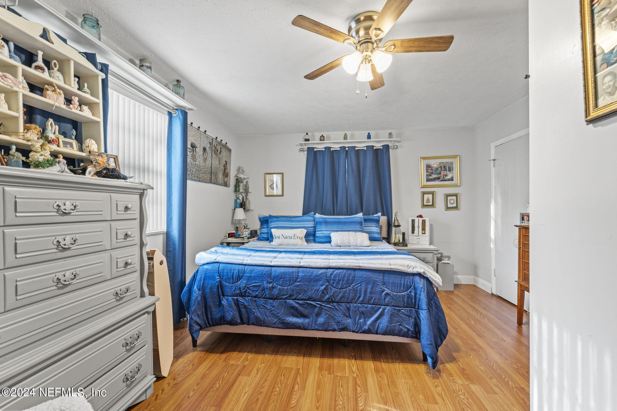 2038 Reed Avenue Jacksonville, FL 32207 - Photo 23 of 43 a bedroom with a bed and a chandelier