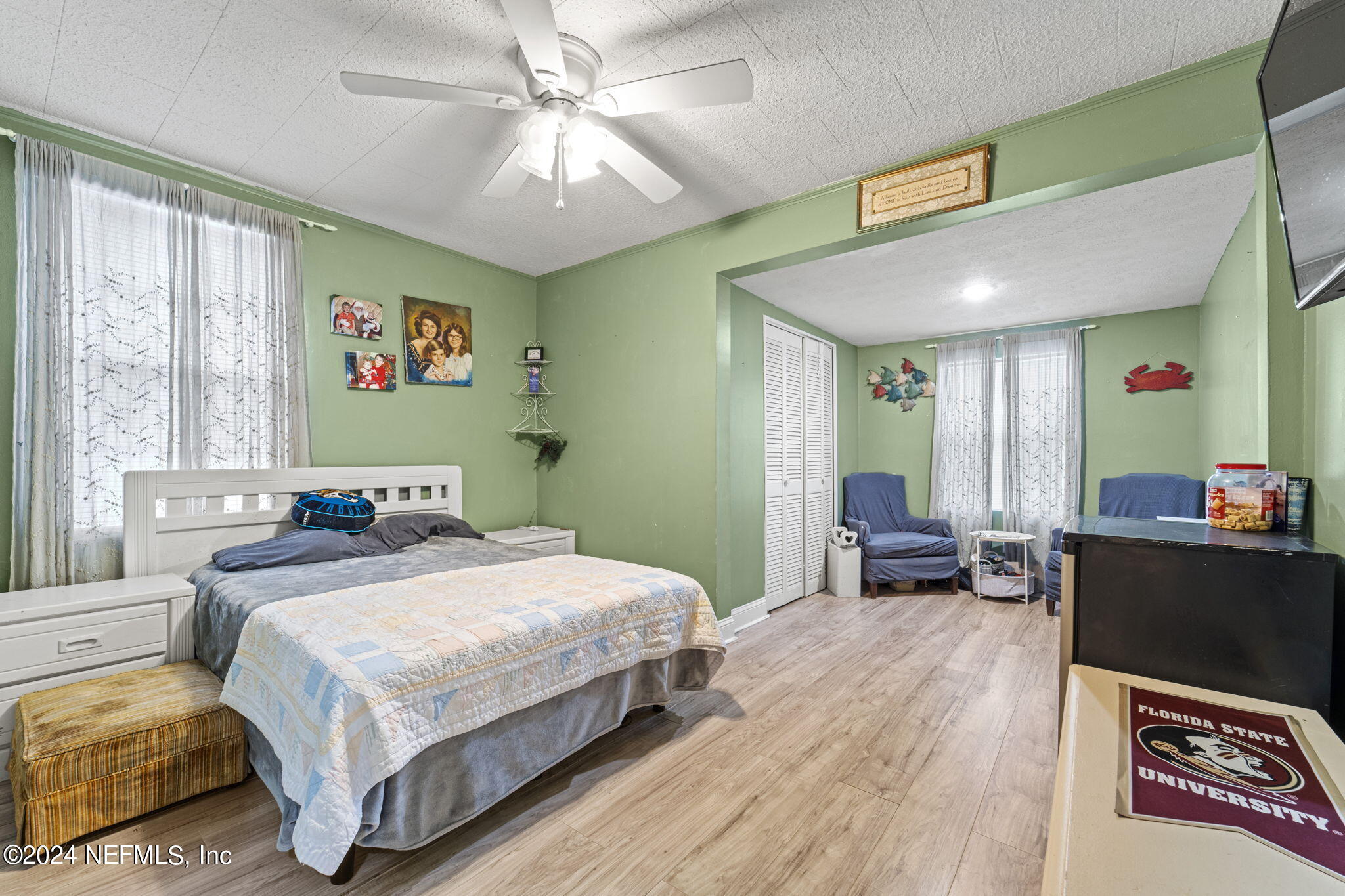2038 Reed Avenue Jacksonville, FL 32207 - Photo 30 of 43 a bedroom with a bed and wooden floor