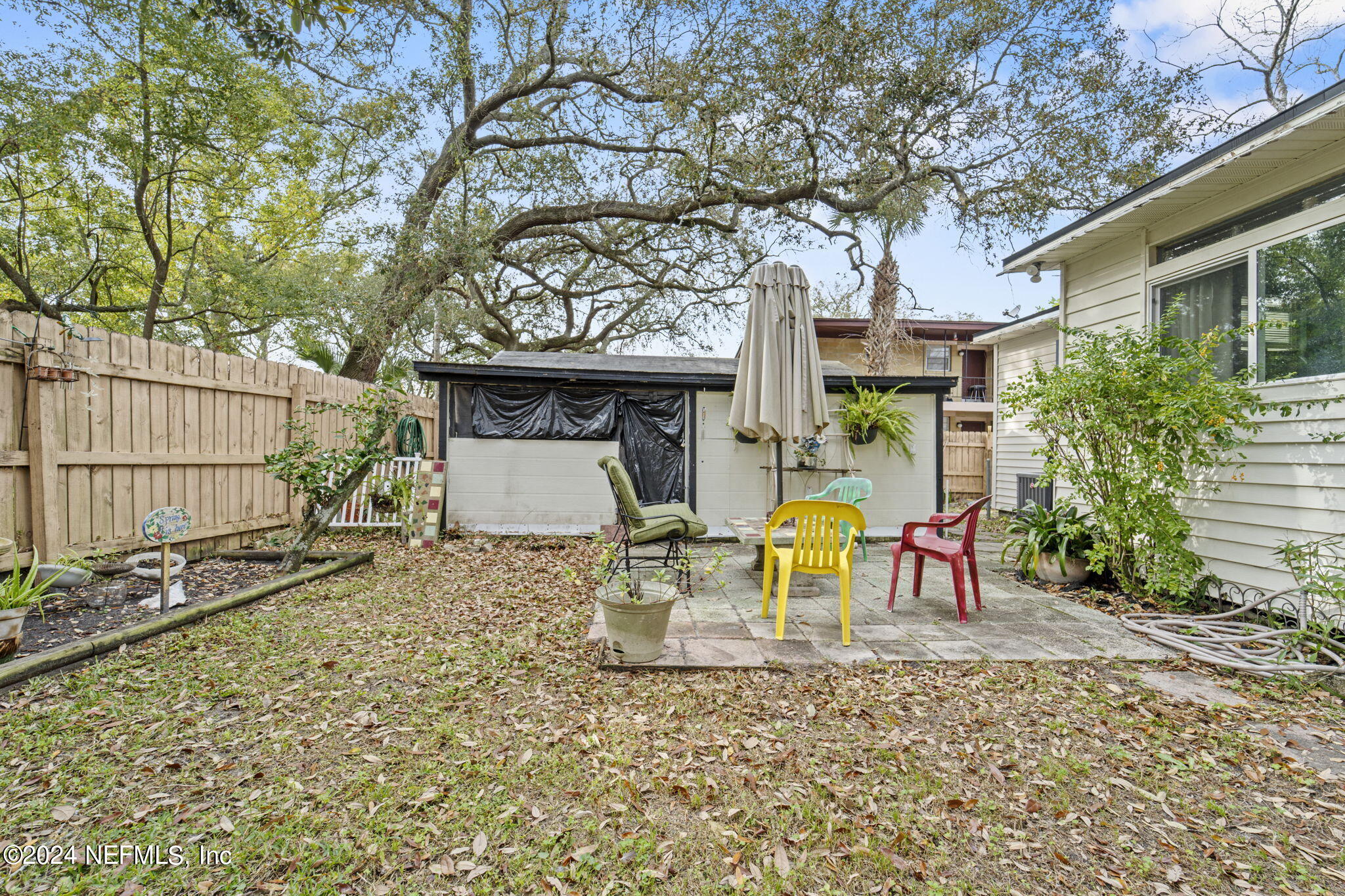 2038 Reed Avenue Jacksonville, FL 32207 - Photo 33 of 43 a view of a chairs and table in the backyard