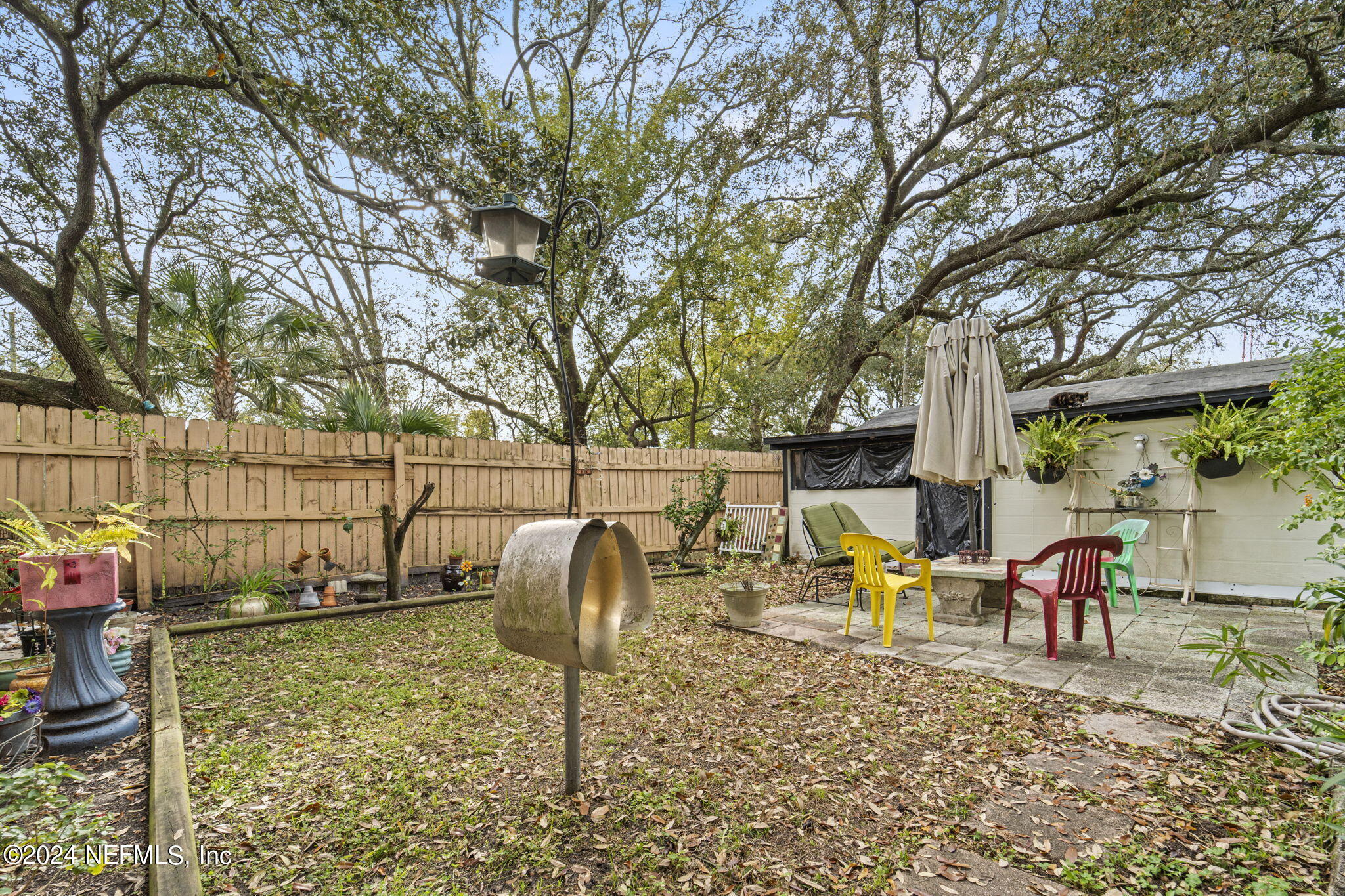 2038 Reed Avenue Jacksonville, FL 32207 - Photo 34 of 43 a backyard of a house with table and chairs