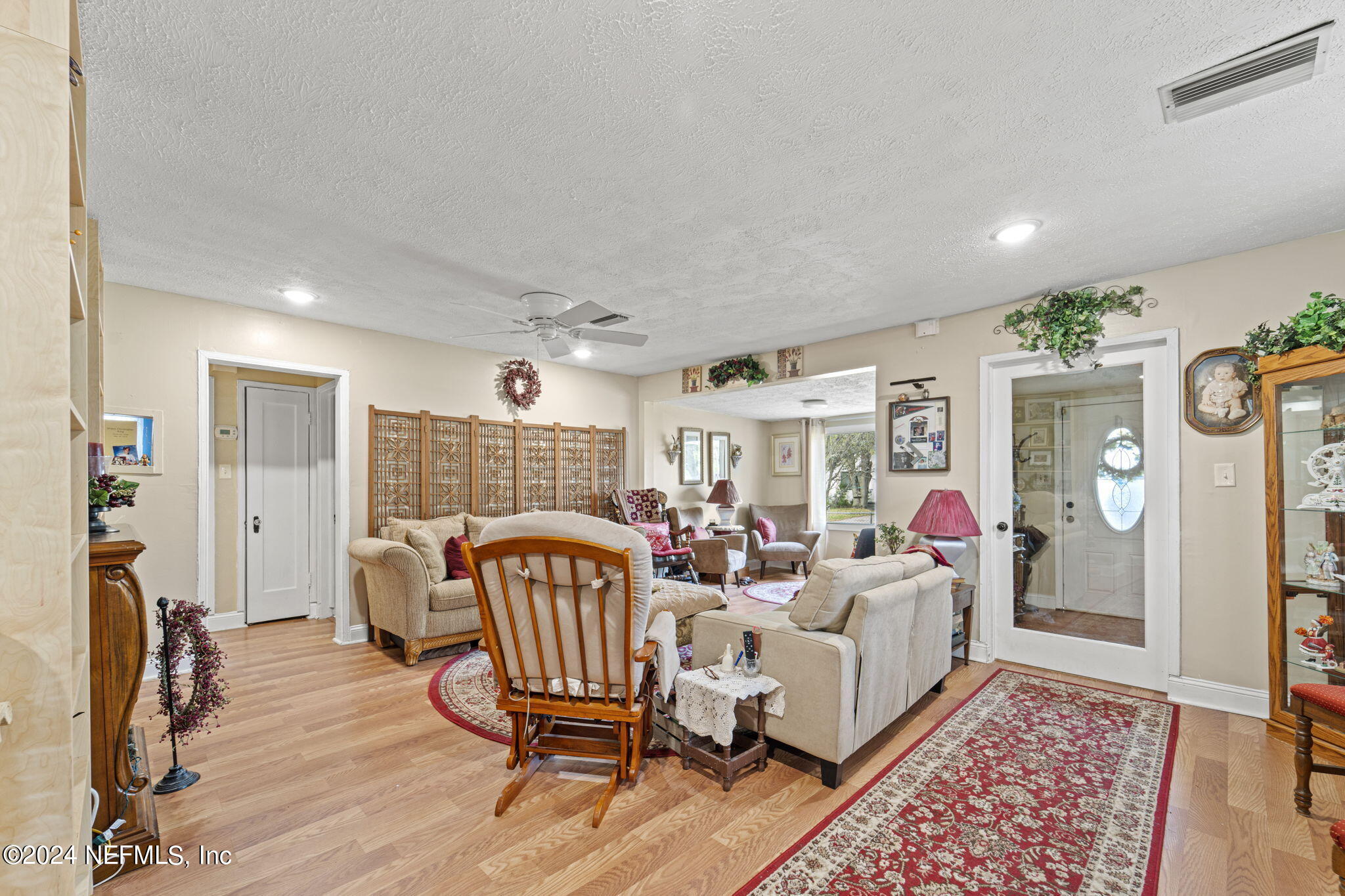 2038 Reed Avenue Jacksonville, FL 32207 - Photo 10 of 43 a living room with furniture and a wooden floor