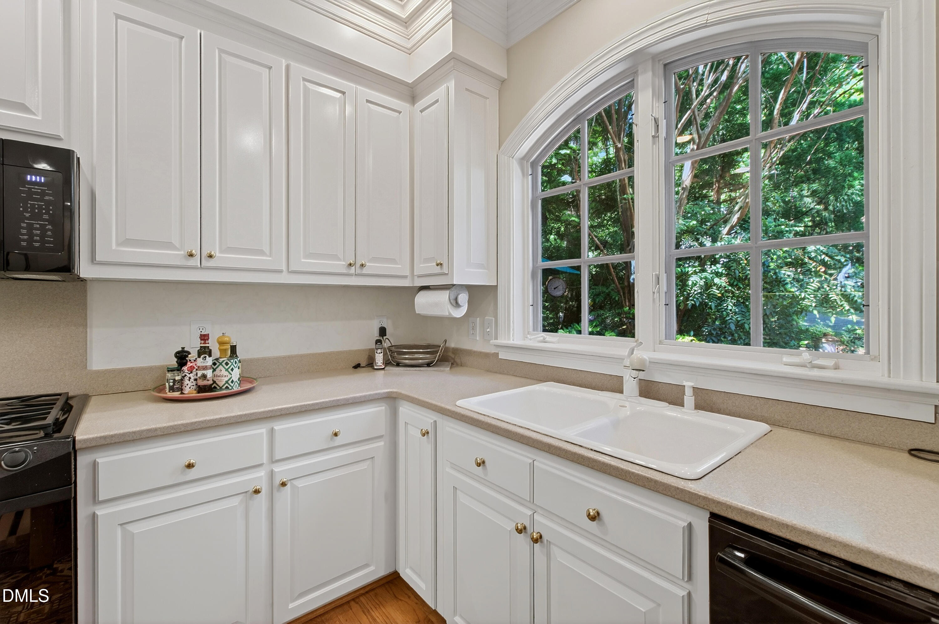 3708 Lubbock Drive Raleigh, NC 27612 - Photo 14 of 64 a kitchen with a sink cabinets and window