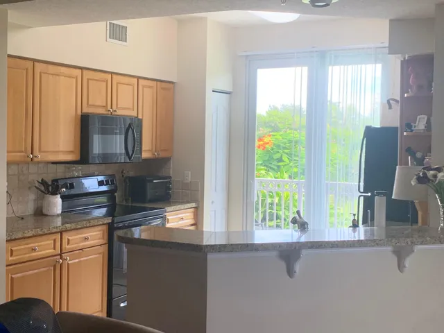 a kitchen with a sink and a window