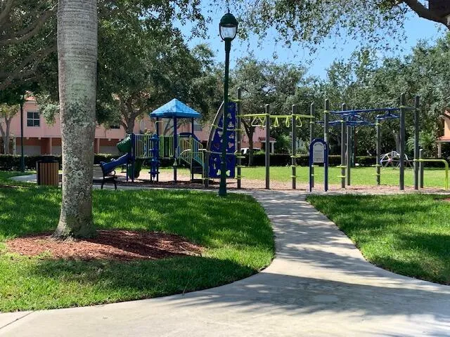 a view of a park with plants and trees