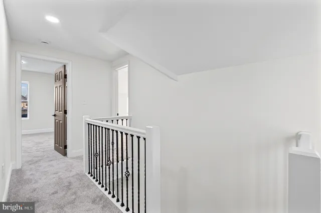 a view of a hallway with a window