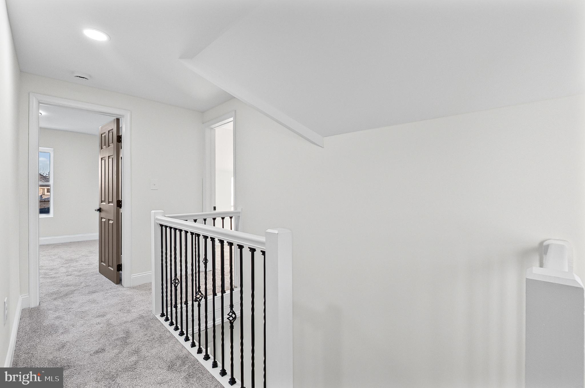 3703 Egerton Road Baltimore, MD 21215 - Photo 17 of 32 a view of a hallway with a window