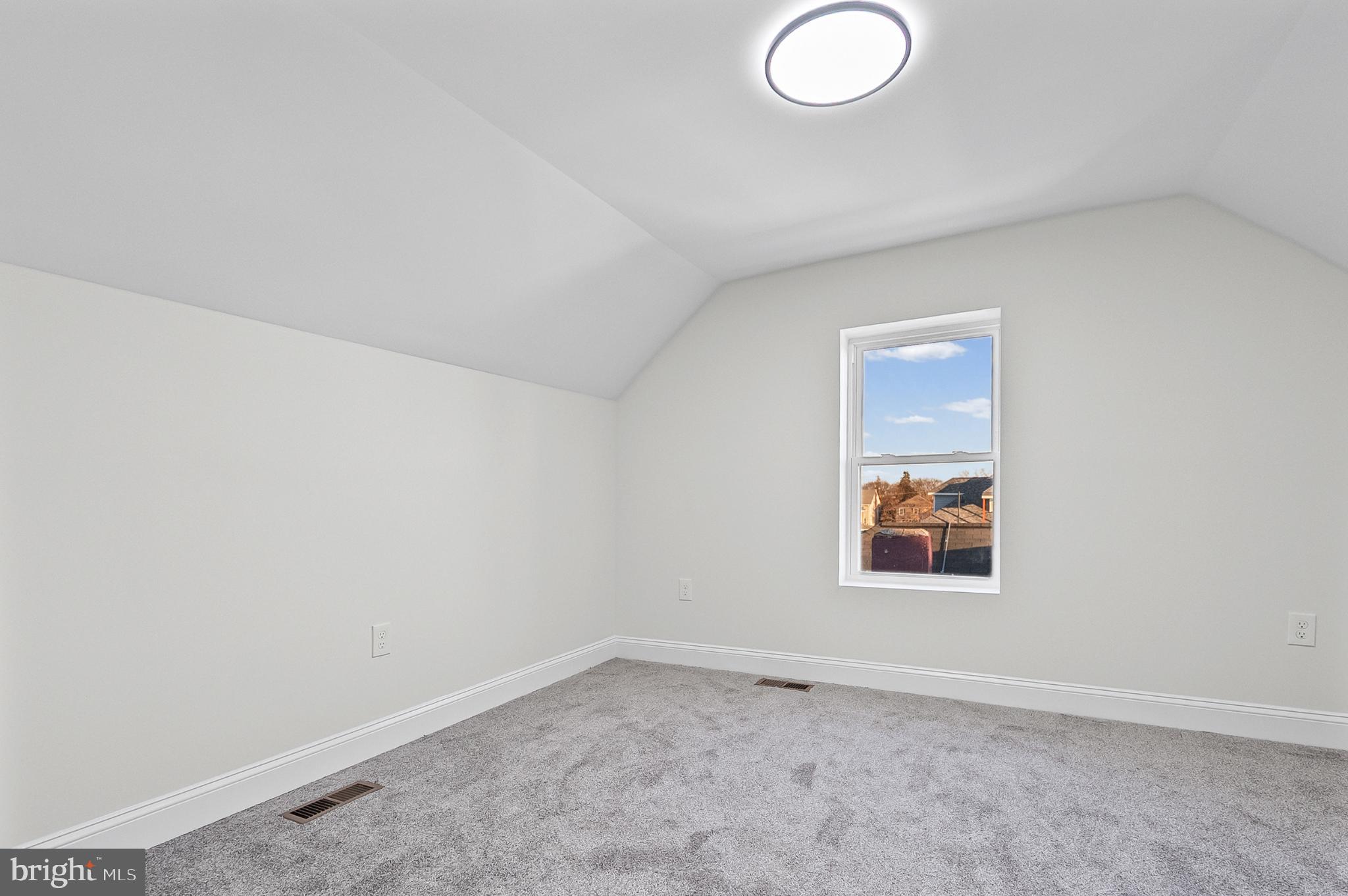 3703 Egerton Road Baltimore, MD 21215 - Photo 20 of 32 an empty room with a window