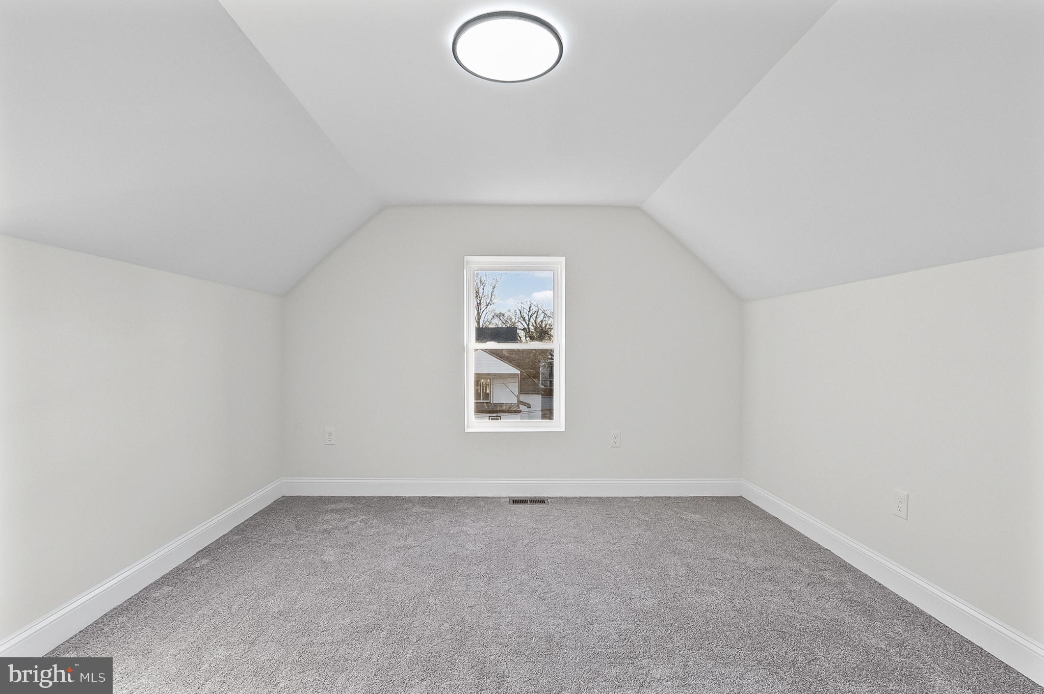 3703 Egerton Road Baltimore, MD 21215 - Photo 22 of 32 an empty room with a window
