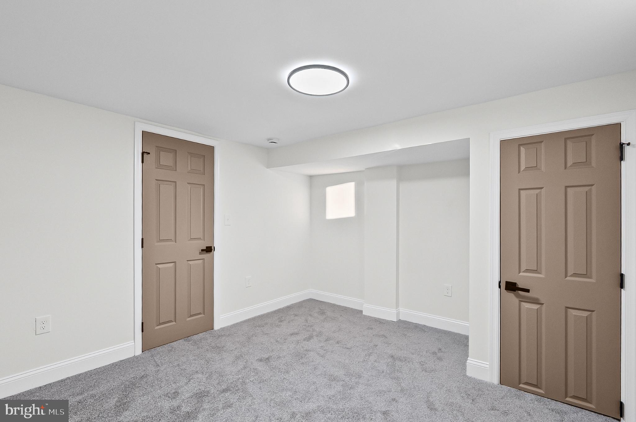 3703 Egerton Road Baltimore, MD 21215 - Photo 30 of 32 an empty room with windows