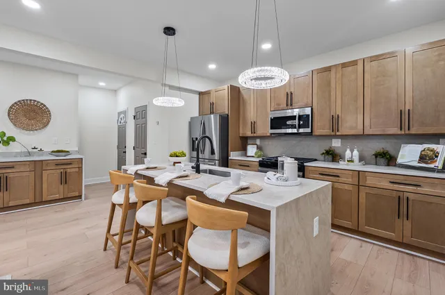a kitchen with a dining table and chairs